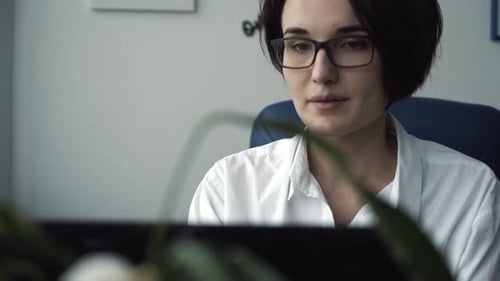 Office Worker Focusing on Laptop Screen