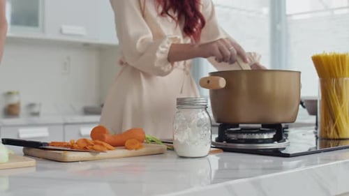 Couple Preparing Fresh Meal Together in Bright Kitchen