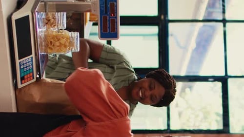 Smiling Women Weighing Bulk Goods at Store