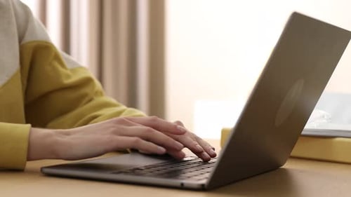 Typing on Laptop Keyboard in Home Setting