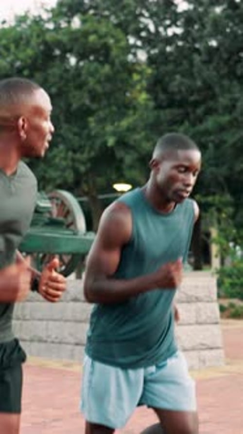 Black man, friends and running for cardio, fitness and wellness in park for urban marathon club