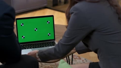 Adults Meeting at Work Using Laptop With Green Screen