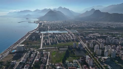 Aerial View of Antalya with Mountains Coastline and Modern Cityscape