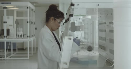 Asian Female Scientist in lab analysis of new corona virus, laboratory
