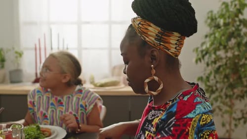 People Eating Food and Talking Together at Home