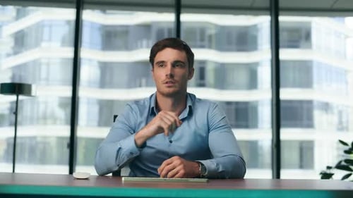 Serious Businessman Using Modern Holographic Digital Interface Application For Analysing Business...