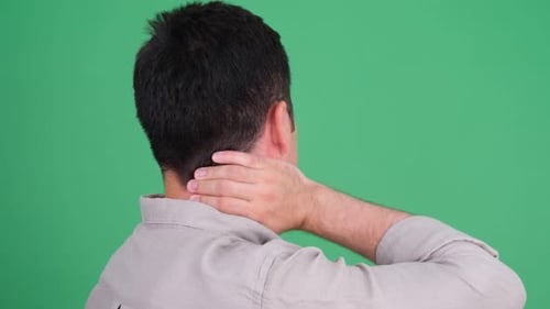Adult Massaging Aching Neck Against Green Screen