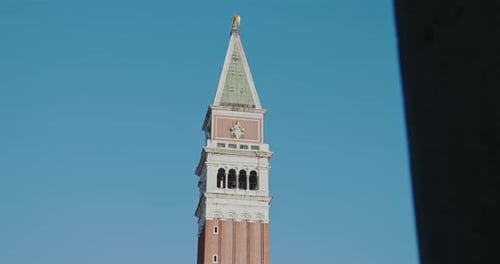 Reveal of the Bell Tower of St Marks Cathedral in Clear Skies Venice Italy