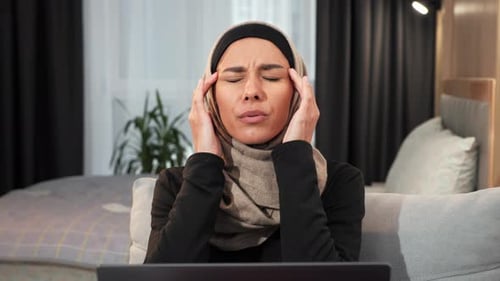 Tired Arabian Muslim Islamic Woman in Hijab Female Worker Feeling Bad at Home