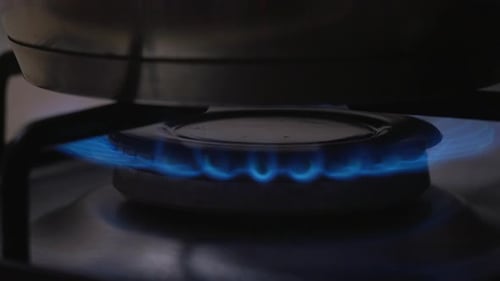 Light gas cooker and pot on it lighted on.