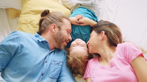 Loving Family Togetherness on Bed