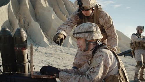 Soldiers are Using Laptop Computer for Surveillance During Military Operation in the Desert. Slow M