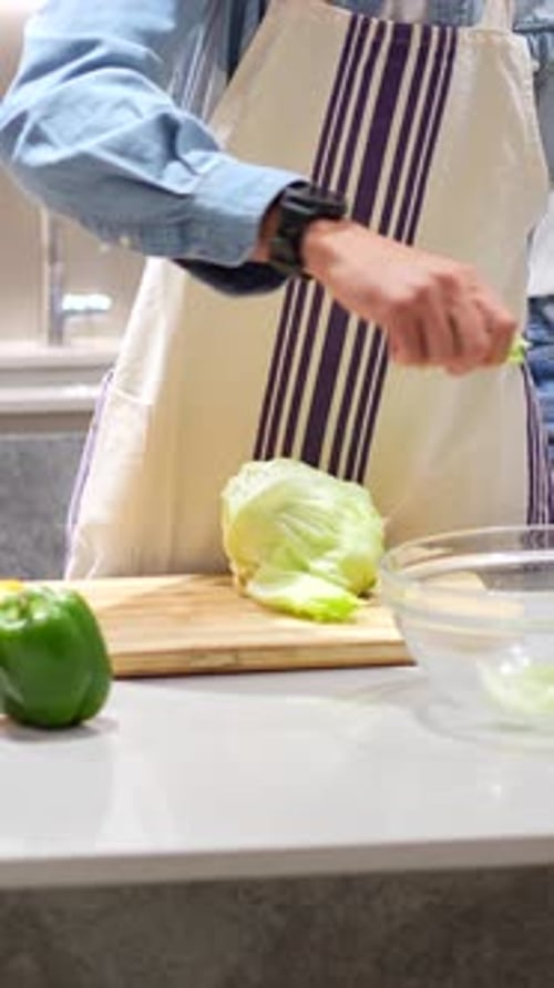 Person Preparing Food in a Home Kitchen