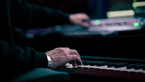 Close Up in the Recording Room Dark Studio Sound Engineer While Playing Records the Sound of