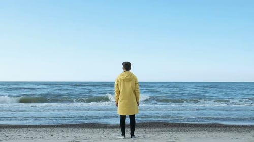 One Adult Hipster Guy Stand, Look at the Waterline and Enjoy To