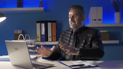 Frustrated Businessman Working Late on Computer