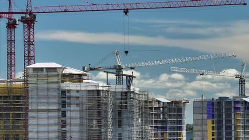 Aerial View of Tower Cranes and Frame Structure of High Residential Apartment Buildings at