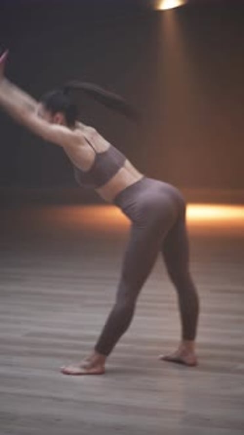 Wellness Female is Doing Yoga Dance in a Mirror Room with Light Lines Flexible Female Performs a