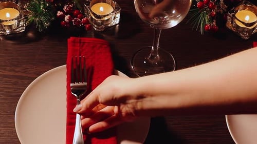 Elegant Holiday Table Setting with Glowing Candles