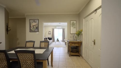 Contemporary home, kitchen, dining room into living room. Family area. White finishes in a white hou