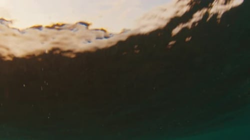 Underwater view of the breaking wave in the Maldives