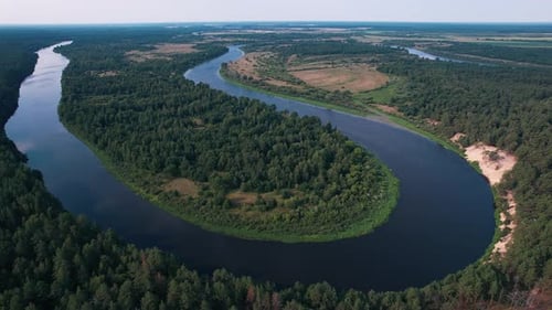Beautiful Aerial View of the Countryside with Fields and Forests and Numerous River Bends in Summer