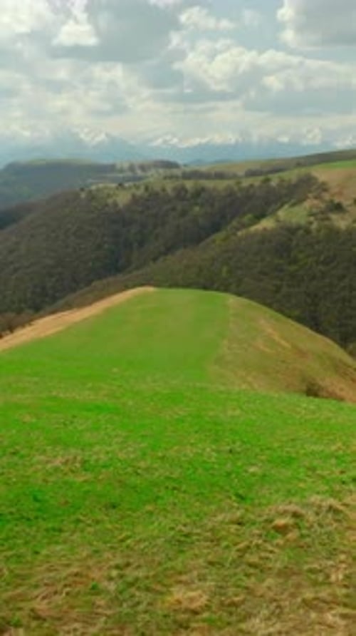 Top View of Hilly Mountains with Green Grass in Summer Shot Beautiful Green Mountain Slopes with