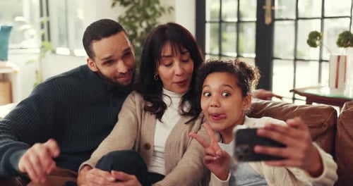 Playful family takes selfie together in cozy home