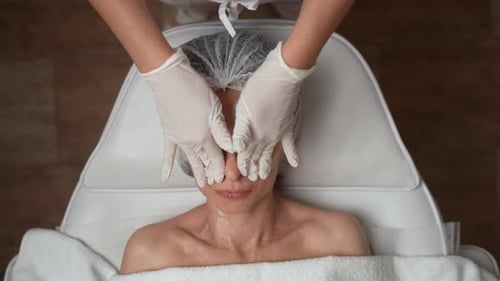 Woman Receiving a Facial at a Spa