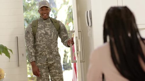 Soldier Returning Home, Hugging Child in Kitchen