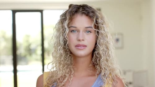 Woman Smiling Portrait in Bright Indoor Setting