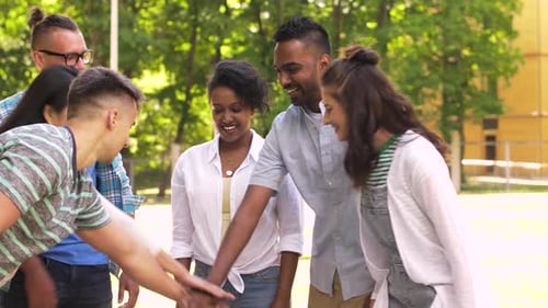 Unity, Friendship and International Concept - Group of Happy Smiling Friends Stacking
