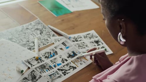 Woman Coloring Comic Book Art in Workplace