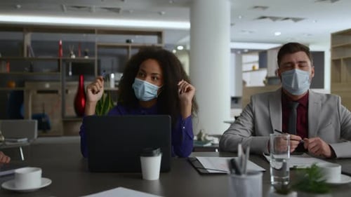 Business Team Meeting with Masks in Modern Office