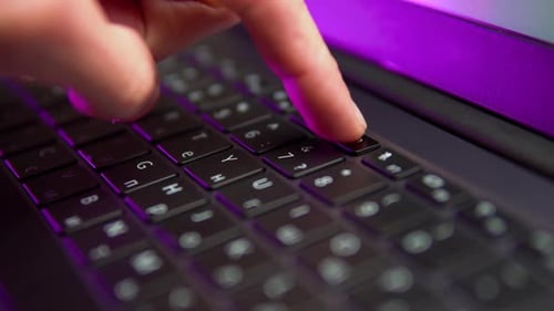 Finger Securing Webcam with Cover on Keyboard