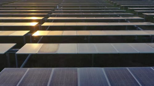 Aerial view of solar panels stand in a row landscape electrical power