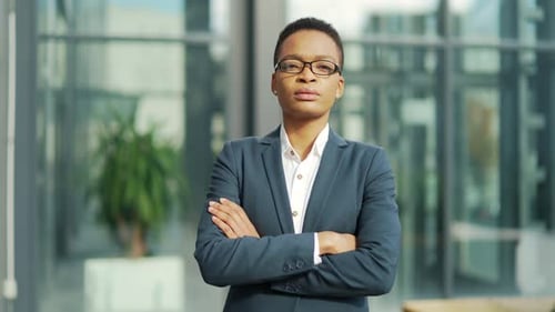 Businesswoman Posing Confidently With Arms Crossed