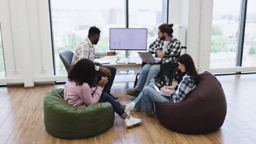Diverse Designers Collaborating in Office During an Inclusive Brainstorming
