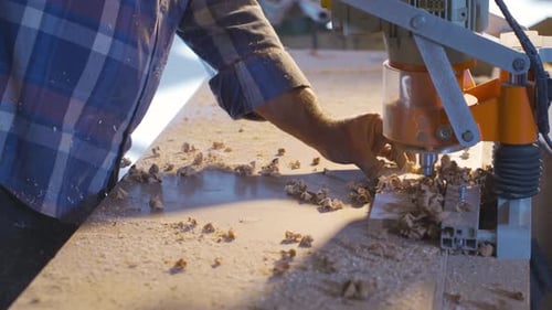 Woodworker Using Milling Machine to Carve Wood