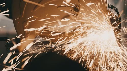 Mechanical Saw Cutting Metal Sending Sparks Flying