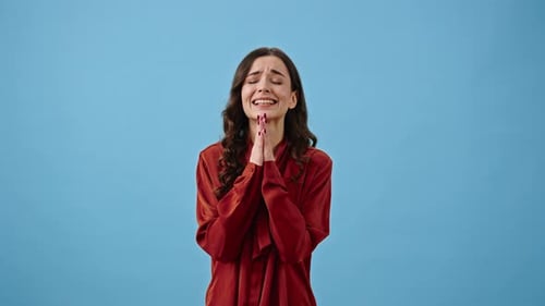 Woman Makes Wish Showing Prayer Gesture and Crossing Fingers