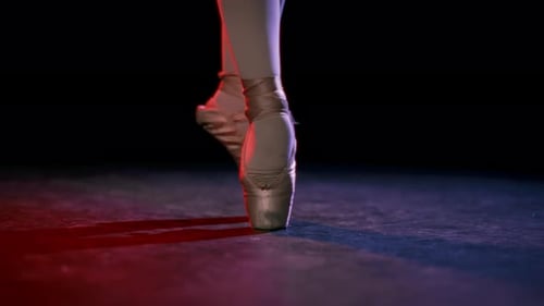 Closeup View of Ballerina Feet in Pointe Shoes in Rehearsal Room or Stage Professional Female Ballet