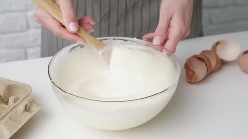 Woman mixing dough, making pie