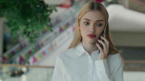 Young Adult Woman Talks on Phone