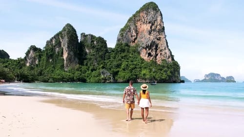 Strolling Hand in Hand Along the Stunning Shores of Railay Beach in Krabi Thailand