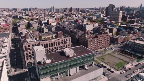 Establishing drone shot of modern city residential neighbourhood, skyline buildings and cityscape, U