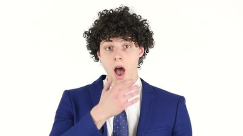 Shocked Man In Blazer Covers Open Mouth