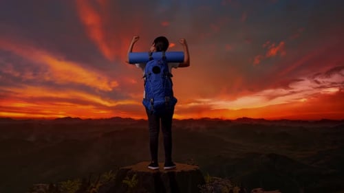 Back View Of A Female Hiker Screaming Goal Celebrating The Success On The Top Of Mountain