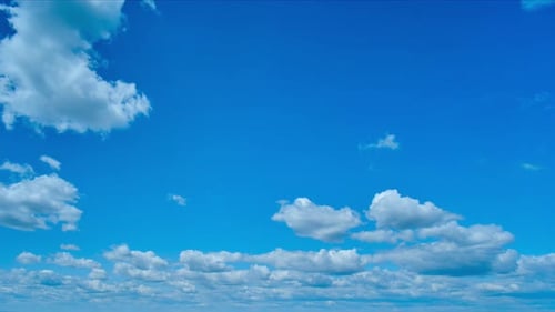 White Clouds Drifting Across a Blue Sky