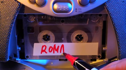 Writing Romantic on Tape Cassette with Red Marker